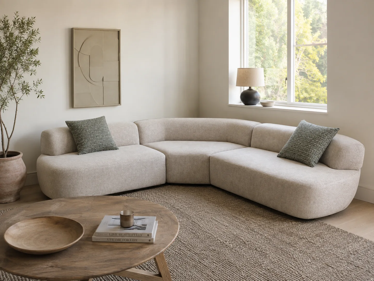 Cream bouclé corner sofa with a curved silhouette