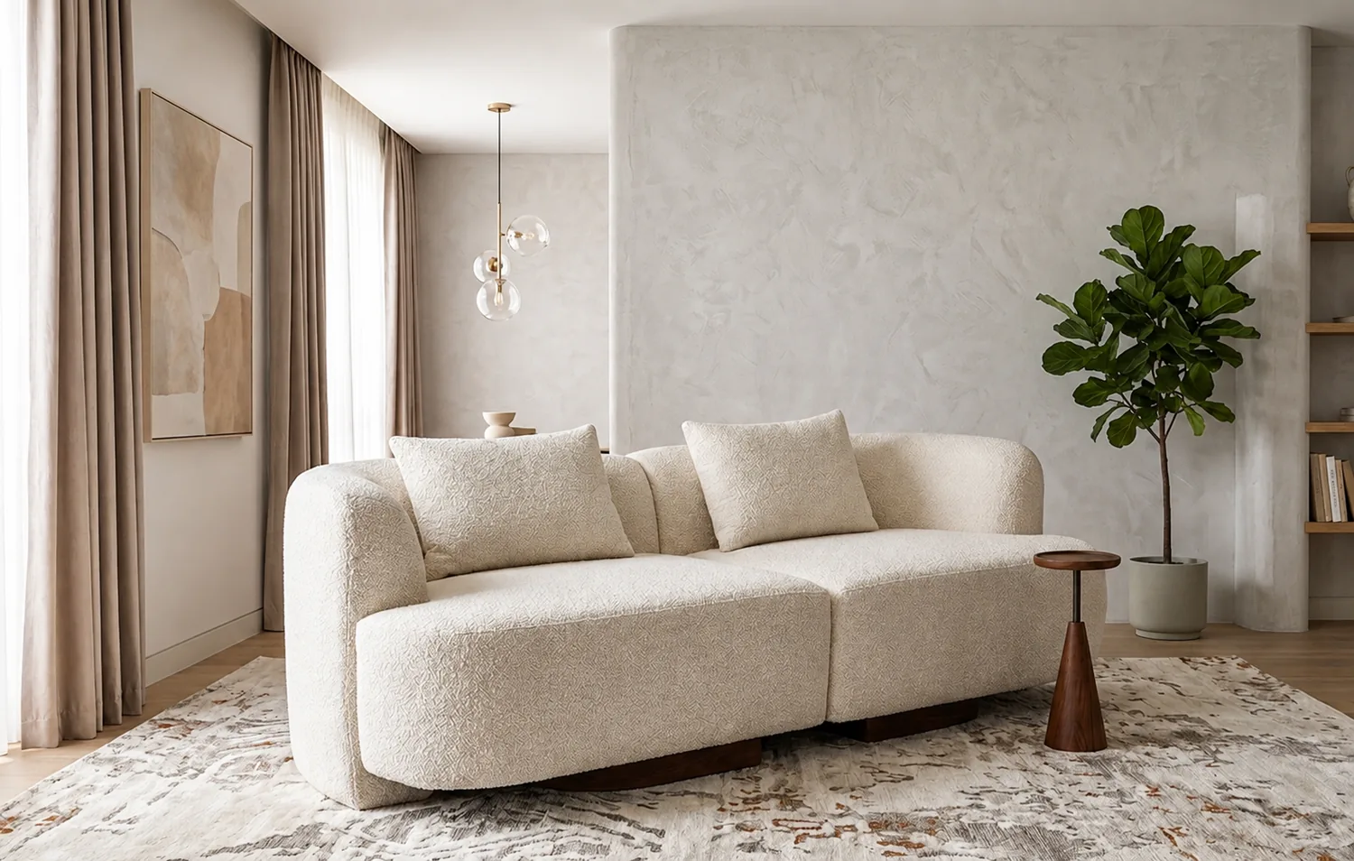 Cream bouclé sofa with rounded arms and a soft seat