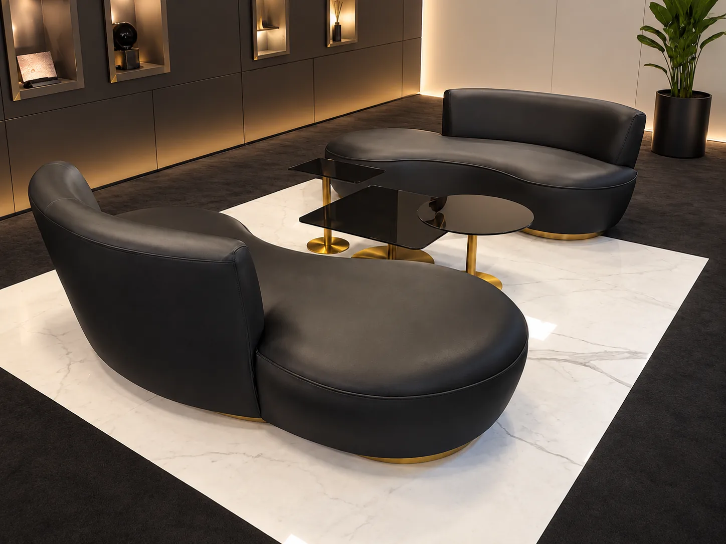 Two curved black leather sofas on brass bases around a smoked-glass table, on a marble inlay in a boutique